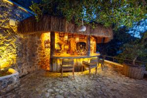 a bar in a building with chairs in front of it at Hotel Unique-Boutique Class - Adults Only in Fethiye