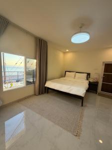 Ένα ή περισσότερα κρεβάτια σε δωμάτιο στο Wadi Shab View