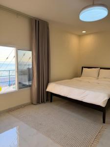 Ένα ή περισσότερα κρεβάτια σε δωμάτιο στο Wadi Shab View +20 φωτογραφίες