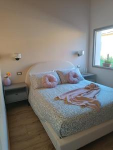 En eller flere senge i et værelse på House Delfina