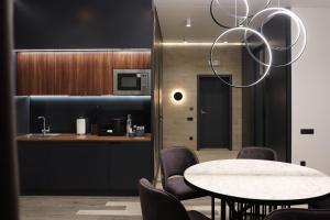 a dining room with a table and chairs at VILSON hotel in Bukovel