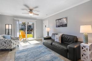 a living room with a couch and a chair at Tranquil Beach Retreat - Fernandina Shores 6398 in Fernandina Beach