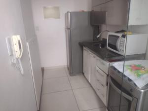 Kuchyň nebo kuchyňský kout v ubytování apto completo c garagem