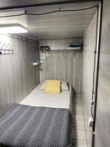 a small room with a bed in a trailer at Personal Room Central in Chişinău