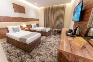 Et tv og/eller underholdning på Snood Al Rayan Hotel