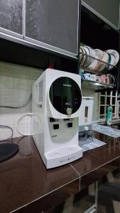 a machine sitting on top of a counter at The Nook Housestay in Ketereh