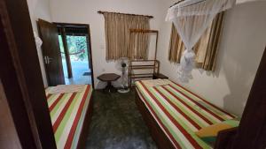 Postel nebo postele na pokoji v ubytování Nature Hub Econ Lodging