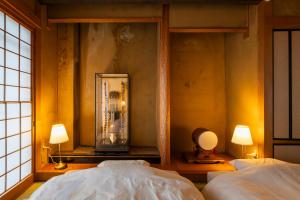 En eller flere senge i et værelse på Entire 3 Story house in Hakata