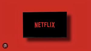 a black sign with the words netflix on a red wall at PICCADILLY Private room and bathroom in Manchester