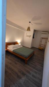 a bedroom with a bed and a ladder in it at Villa Fatjo in Le Tampon