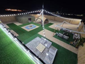 an overhead view of a backyard at night at Lawrence in Nafīr