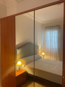 En eller flere senge i et værelse på Espera Apartamentos