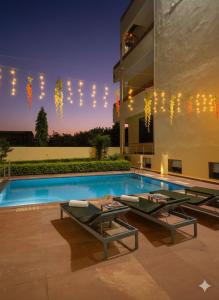 a house with a swimming pool with lights above it at The Ranthambore Samrajya Tiger Seven in Sawāi Mādhopur