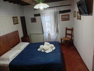 Postel nebo postele na pokoji v ubytování Albergo ristoranteL'ARCILE