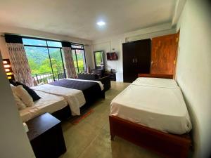 Кровать или кровати в номере Babarakanda holiday resort