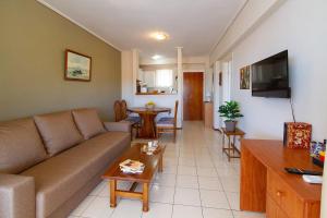 a living room with a couch and a table at Amadolia in Loutra Edipsou