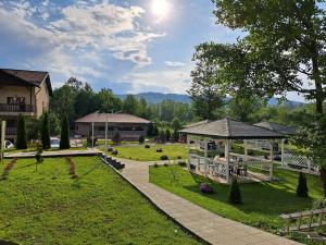 a park with a gazebo and a building at Cornu Complex Mem in Campina
