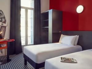 Postel nebo postele na pokoji v ubytování ibis Styles Marseille Vieux Port