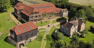 an aerial view of a large house with a yard at Wallace Hill Cottage - Garsington Studios - Pass the Keys in Stokenchurch