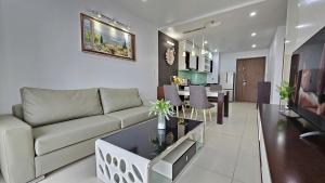 a living room with a couch and a dining room at AnE House 1 - Spacious 2BR Apartment 69m2 - SHP Plaza - Hai Phong City Center in Hai Phong