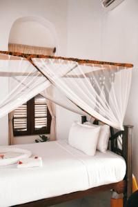 Postel nebo postele na pokoji v ubytování Habari House + 39 fotografií