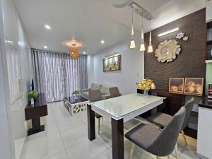a kitchen and dining room with a table and chairs at AnE House 1 - Spacious 2BR Apartment 69m2 - SHP Plaza - Hai Phong City Center in Hai Phong