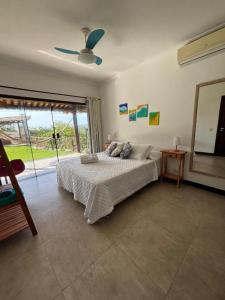 En eller flere senge i et værelse på Pousada Ganesha Búzios