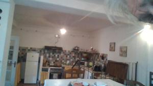 a kitchen with two lights on the ceiling in a room at Il cotogno in Carrosio