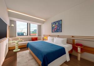 Giường trong phòng chung tại Savvy by M Village Hai Ba Trung - Saigon Downtown