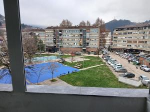 a view from a window of a parking lot at Novi Priboj in Čitluk