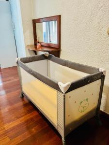 a bed in a room with a mirror at L'Etape du Bonheur in Cilaos +15 photos