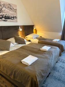 Postel nebo postele na pokoji v ubytování ZAJAZD BIAŁCZAŃSKI Dom Wypoczynkowy Restauracja + 112 fotografií