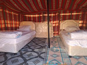 Postel nebo postele na pokoji v ubytování ESCAPE cAMp2