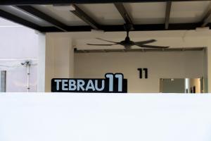 a sign on top of a counter in a room at TEBRAU 11 Guesthouse in Johor Bahru +37 photos