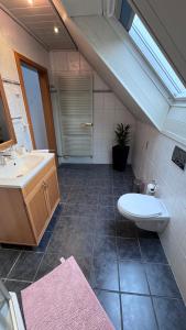 a bathroom with a sink and a toilet at Ferienhaus in Lambsheim- "Familienfreundlich", PlayStation-FIFA in Lambsheim