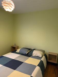 a bedroom with a large bed in a room at La ferme de Marin in Marin