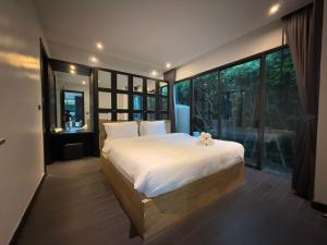 Postel nebo postele na pokoji v ubytování 2 Bedroom Pool villa Chalong