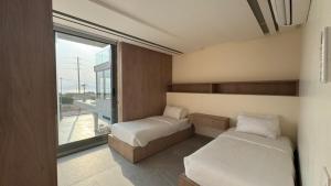 Postel nebo postele na pokoji v ubytování AK Luxury Chalet + 26 fotografií