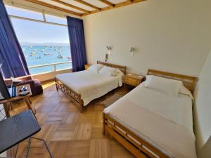 Postel nebo postele na pokoji v ubytování Hotel Panoramico