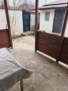 an outside view of a house with a patio at Casa Razu G2 in Craiova