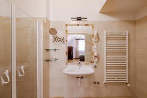 a bathroom with a sink and a shower at Giselle Buda Castle in Budapest