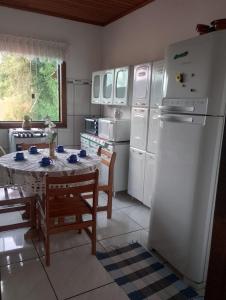 Kuchyň nebo kuchyňský kout v ubytování Aconchego Vilela