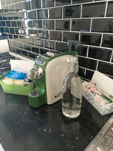 a bottle of water sitting on top of a counter at Family Place Fiumicino in Fiumicino