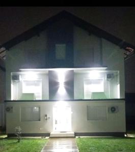 a house with a front door with lights on it at Stan na dan Ugljevik Centar in Ugljevik +10 photos