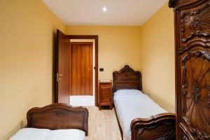 Postel nebo postele na pokoji v ubytování Chez Mario - 2 bedroom - Parking