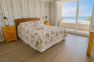 En eller flere senge i et værelse på AQUA – Mar, Espacio, Vista y Comodidades Premium + 38 billeder