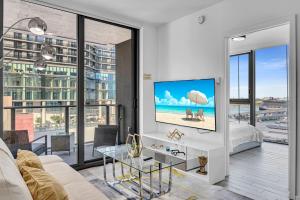 a living room with a view of the beach at Waterline Corner Vies 2Br 2BA Suites in Miami