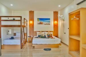 Postel nebo postele na pokoji v ubytování The Holiday Garden View