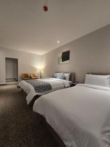 Ένα ή περισσότερα κρεβάτια σε δωμάτιο στο Baghdad Business Hotel - فندق اعمال بغداد +16 φωτογραφίες