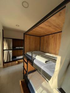 a room with two bunk beds in a room at Downtown River Hostel in Donostia-San Sebastián